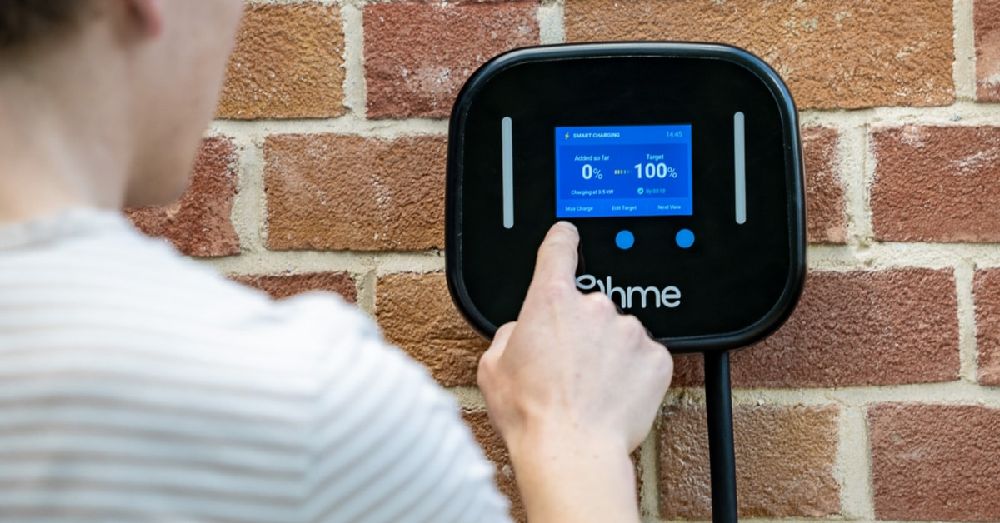 Adjusting settings on an Ohme Home Pro EV charger.